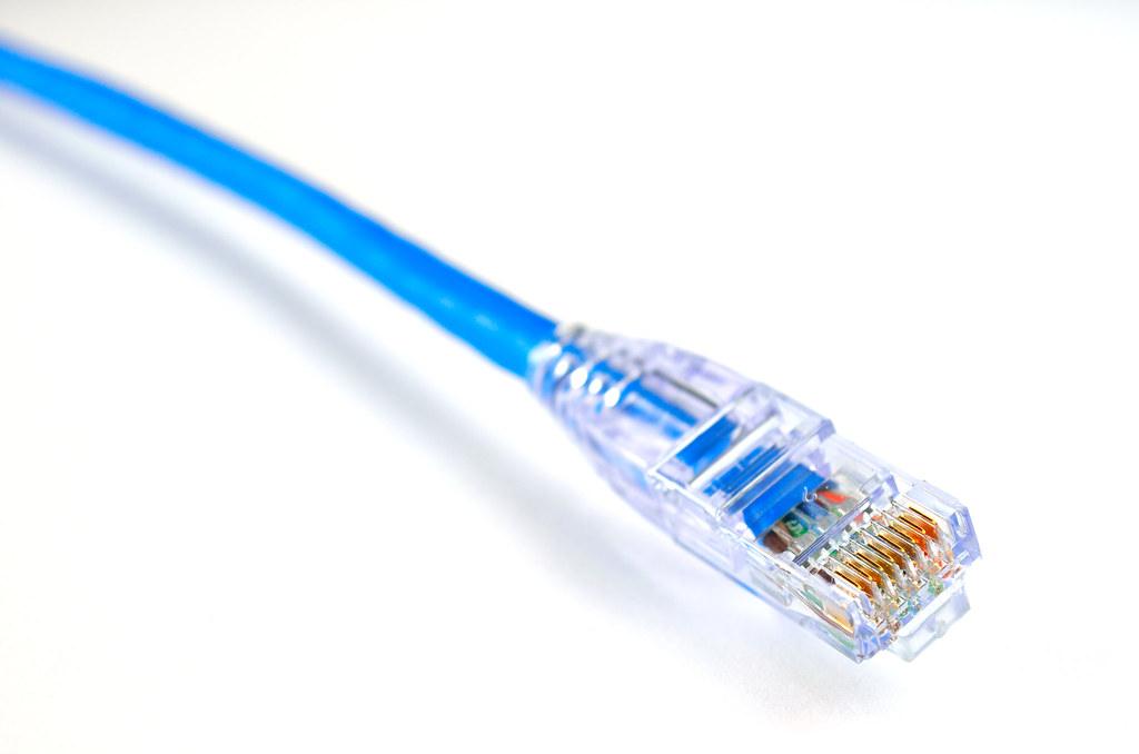 Blue ethernet cable used for a cabled fibre speed test to diagnose slow internet