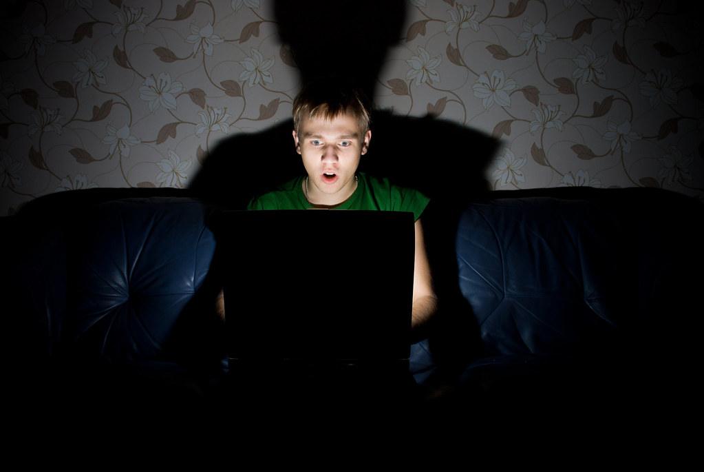 Person at a laptop representing phishing threats